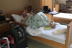 R.-Miller-enjoying-us-passing-his-room-scaled