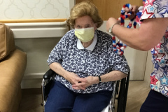 Brenda-giving-H.-Shaffron-a-red-white-and-blue-necklace