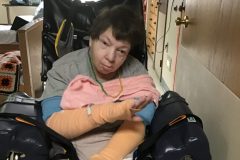 B.-Scherer-enjoying-the-music-while-sporting-her-beads-scaled-e1613582929116