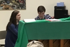 Maci-helping-to-turn-pagers-for-Mitchell